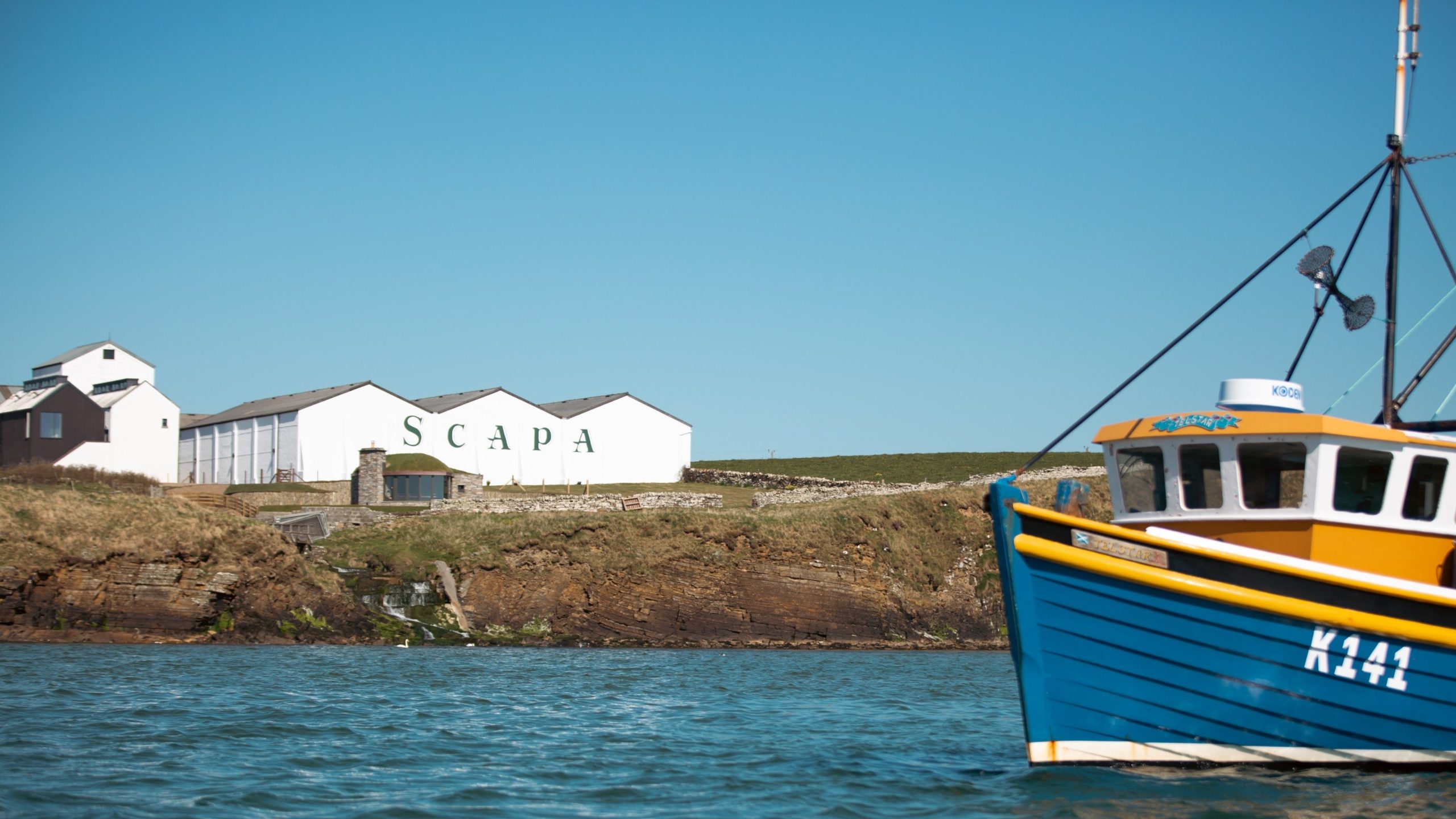 Boat sailing at Scapa Whisky Distillery